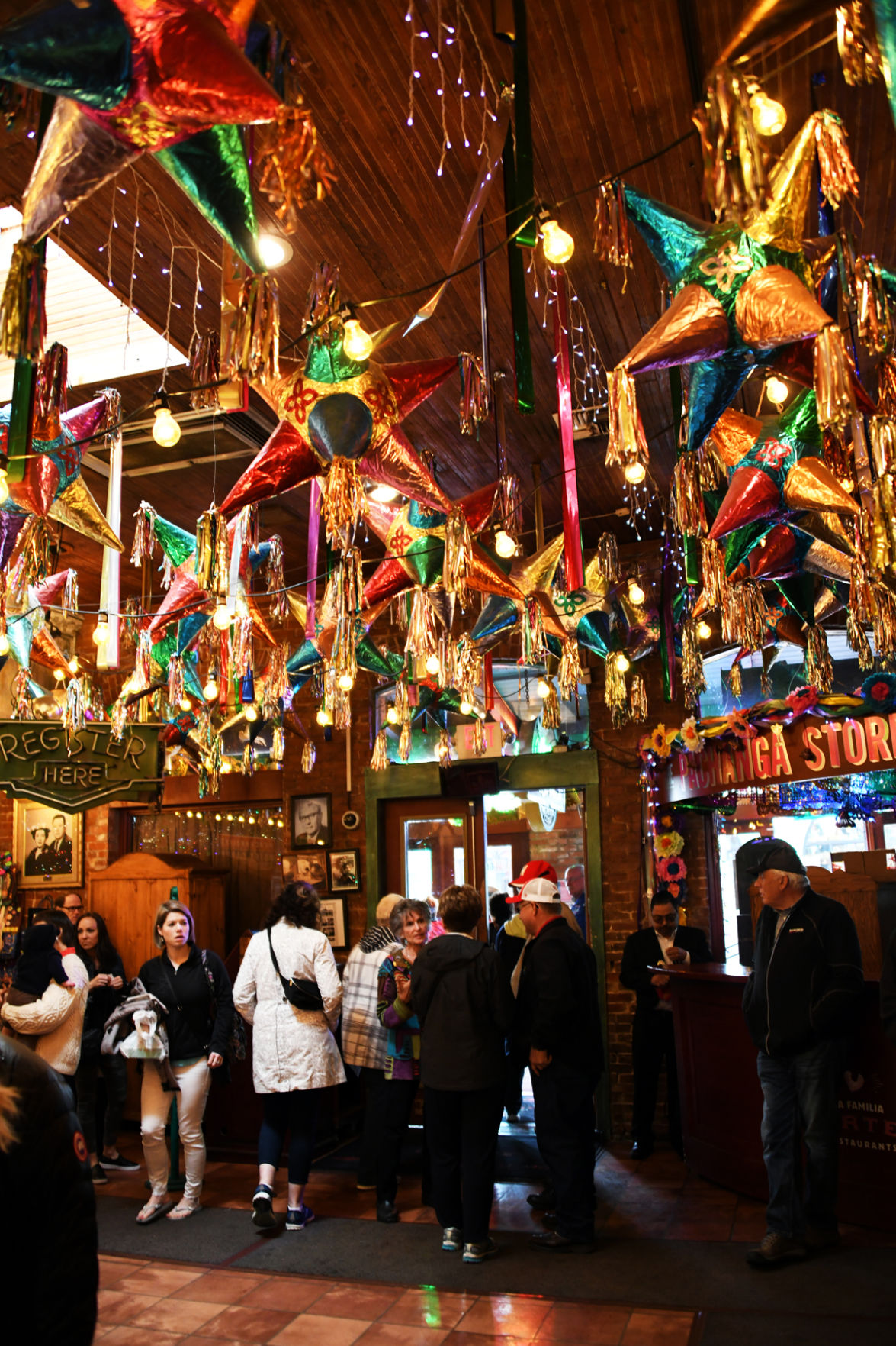 126 Fun Club travelers exit the festive Mi Tierra Cafe in the El Mercado marketplace.JPG